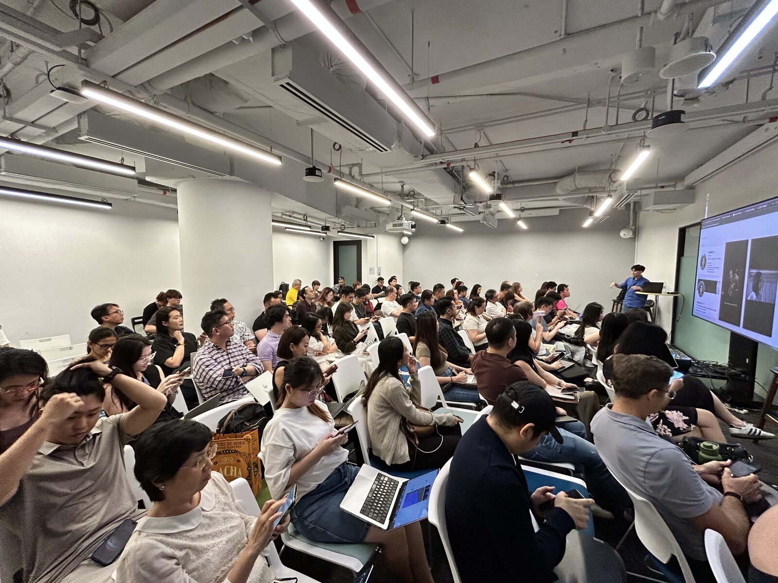 Community speaker Varick presenting talking-head video editing at AI Power Users Meetup 03